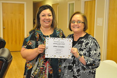 Picture of Debra Lewallen, HIM Manager- being awarded by CEO,Leticia Rodriguez for being Ward Memorial Hospital 2nd Quarter Shining star recipient.